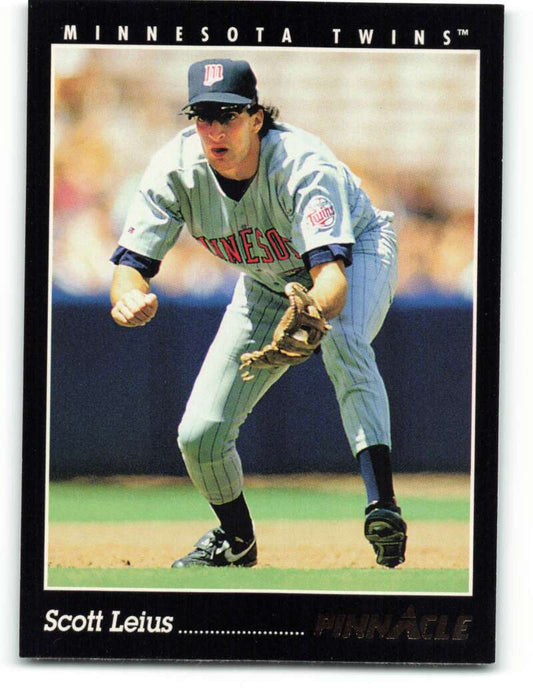 Scott Leius in Minnesota Twins pinstripe uniform crouched for fielding on baseball card