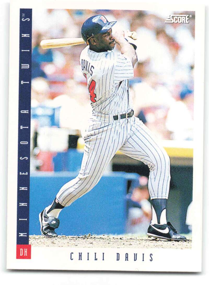 Baseball card of Chili Davis swinging in a Minnesota Twins pinstriped uniform