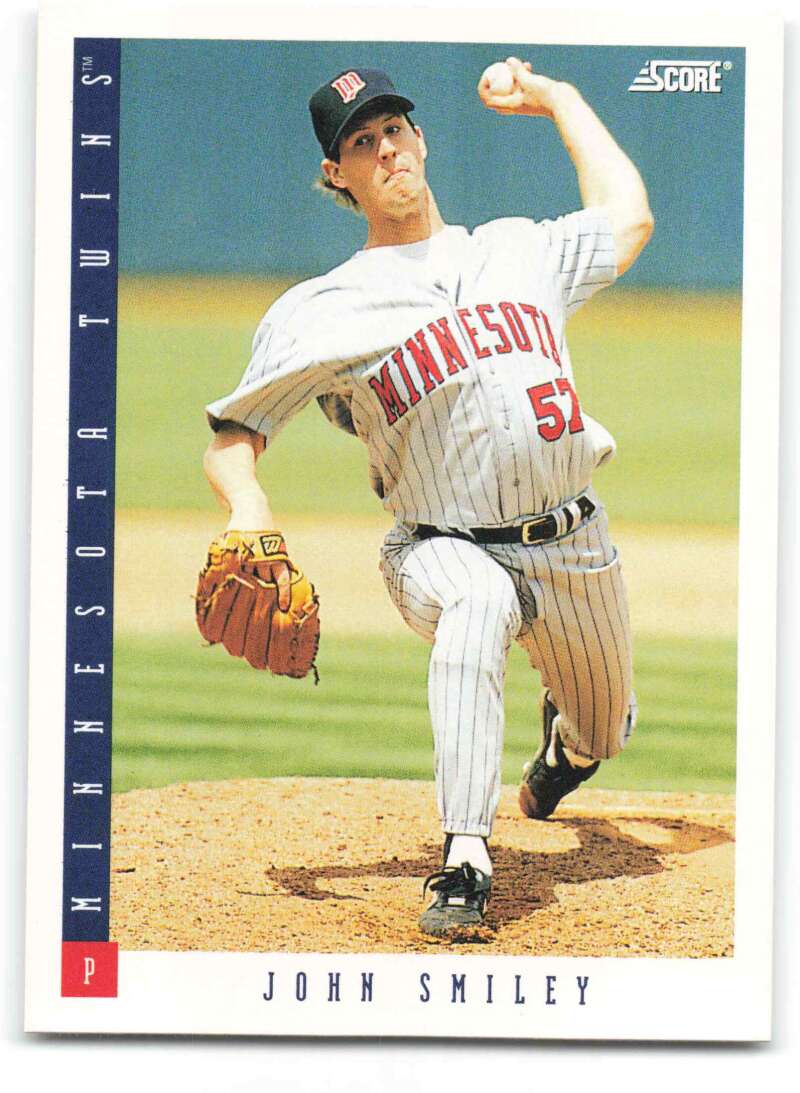 Minnesota Twins baseball card of John Smiley in mid-throw wearing pinstriped uniform