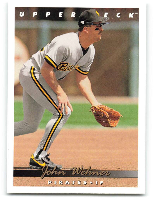 Baseball player fielding at first base in Pittsburgh Pirates gray uniform on card