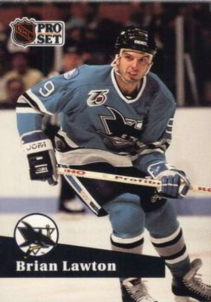 Hockey player in light blue San Jose Sharks jersey skates with stick, Brian Lawton card