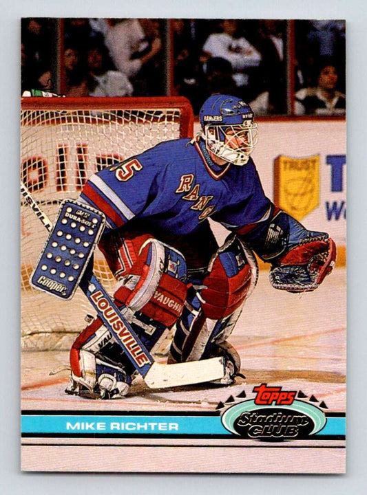 Mike Richter in a New York Rangers jersey ready to defend on Topps Stadium Club card