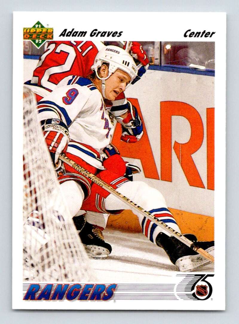 Adam Graves skating near the boards in a New York Rangers jersey for Upper Deck card