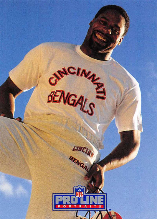 White Cincinnati Bengals t-shirt with red lettering featuring Rodney Holman football card design