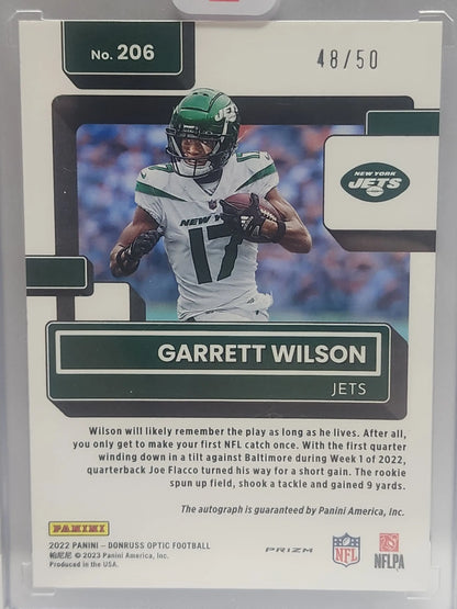 NFL trading card of Garrett Wilson in New York Jets uniform, Panini Optic Purple Stars Auto