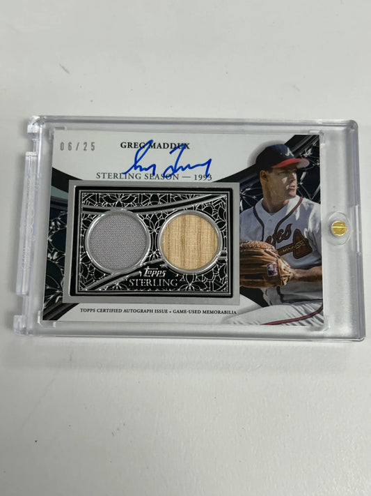 Baseball trading card of Greg Maddux with jersey patch, bat fragment, and autograph