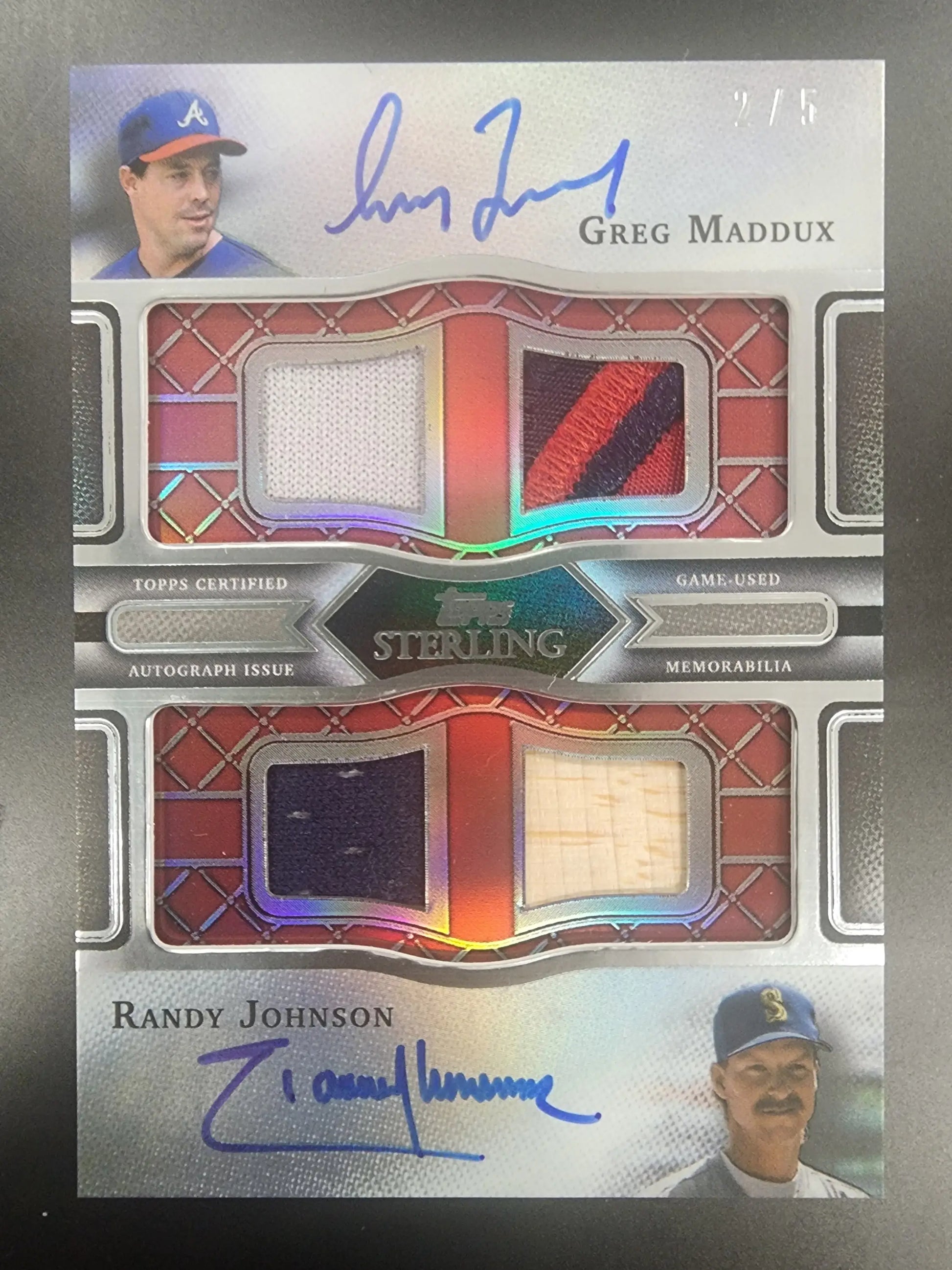 Baseball card featuring dual autographs and jersey patches of Greg Maddux Randy Johnson Topps Sterling Quad