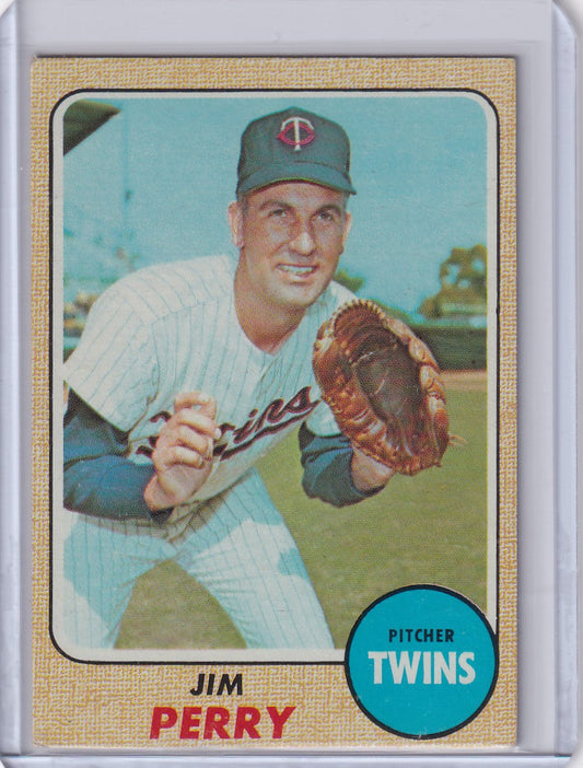 Vintage Topps Baseball card of Jim Perry in throwing stance for Minnesota Twins