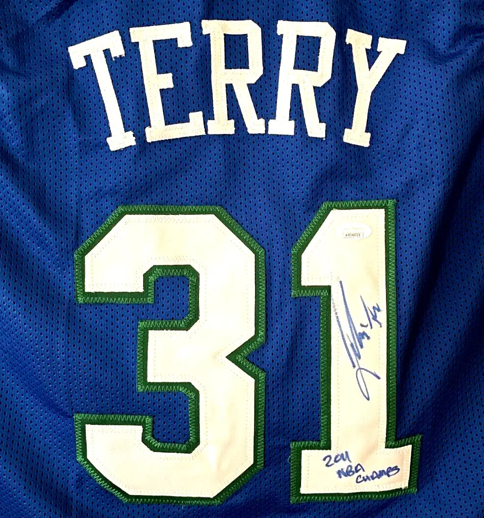 Blue Dallas Mavericks NBA jersey signed by Jason Terry with white and green accents