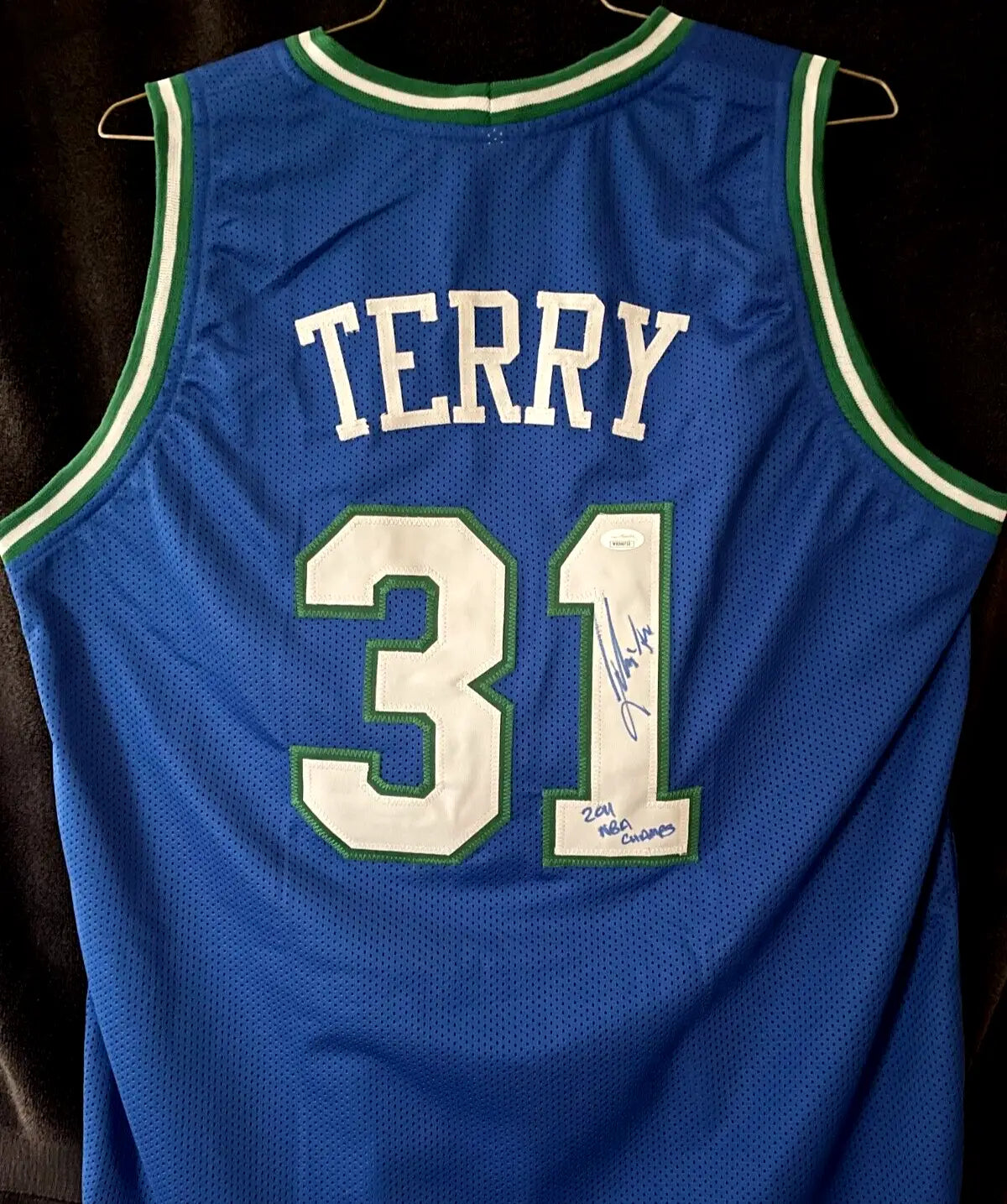 Blue Dallas Mavericks NBA jersey signed by Jason Terry, featuring name and number 31