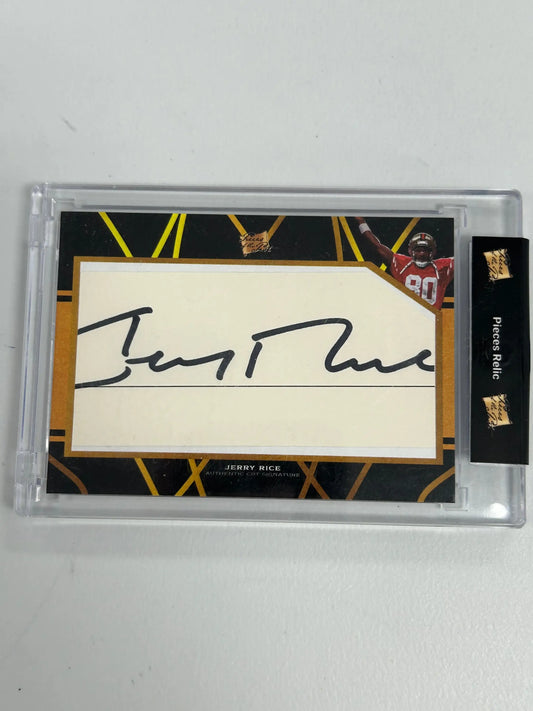 Autographed Jerry Rice card in protective case with black and gold geometric design