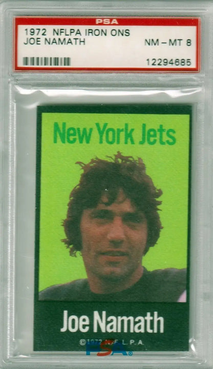 PSA-graded 1972 NFLPA Iron Ons Joe Namath trading card on bright green background, Columbia Hobby