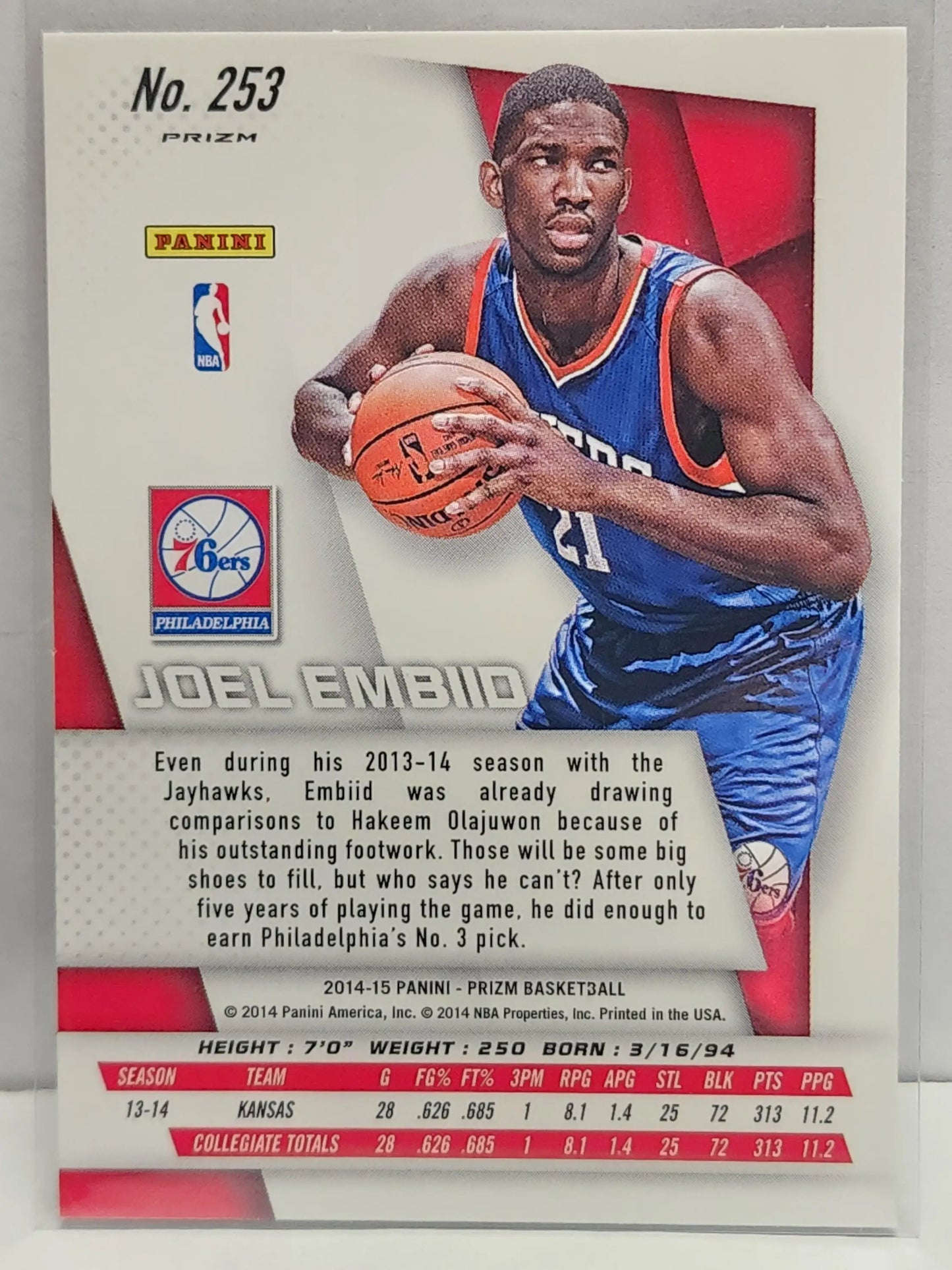 Joel Embiid 2014 Panini Prizm Rookie card in red white blue design holding a basketball