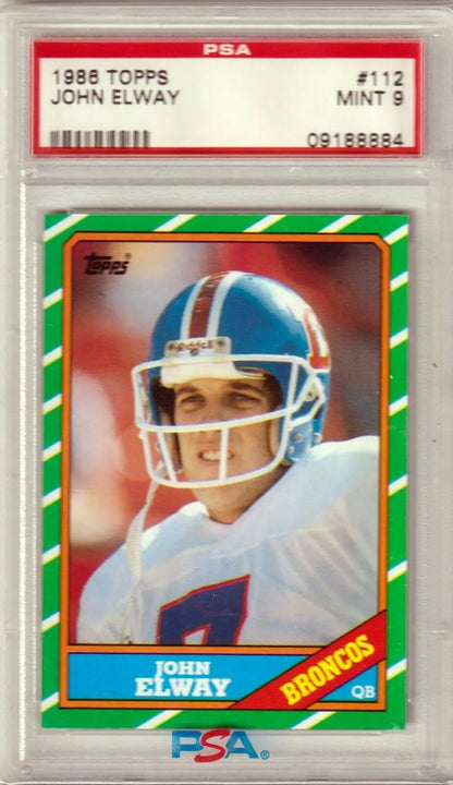 PSA-graded 1986 Topps John Elway football card with red and green border from Columbia Hobby