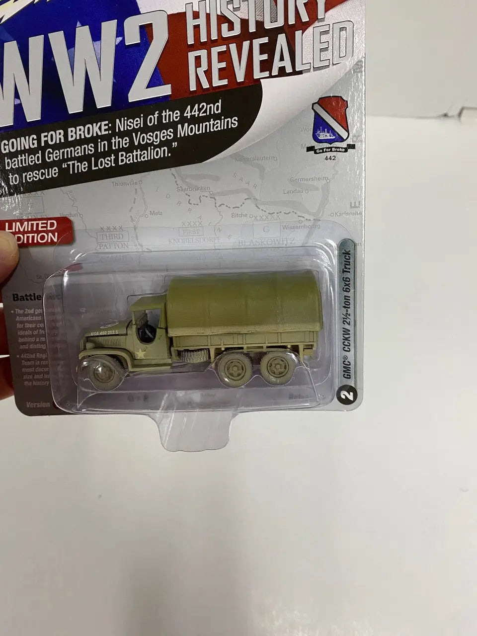 Die-cast model of Johnny Lightning WW2 GMC CCKW 2 1/2 Ton Truck in olive drab color