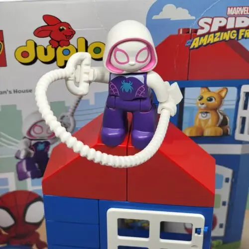 LEGO Spider-Gwen minifigure in purple and white on blocks from Spider-Man’s House set