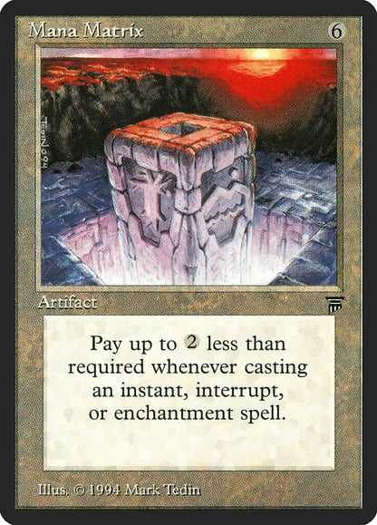 Stone cube with carved faces above reflective surface in Magic: The Gathering trading cards