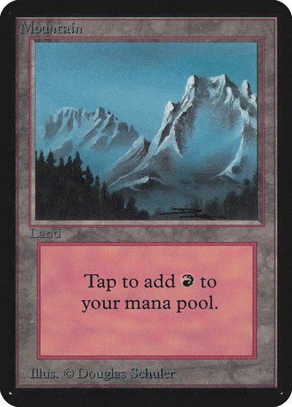 Snow-capped mountain peaks above dark forest in Magic: The Gathering Alpha Edition trading card