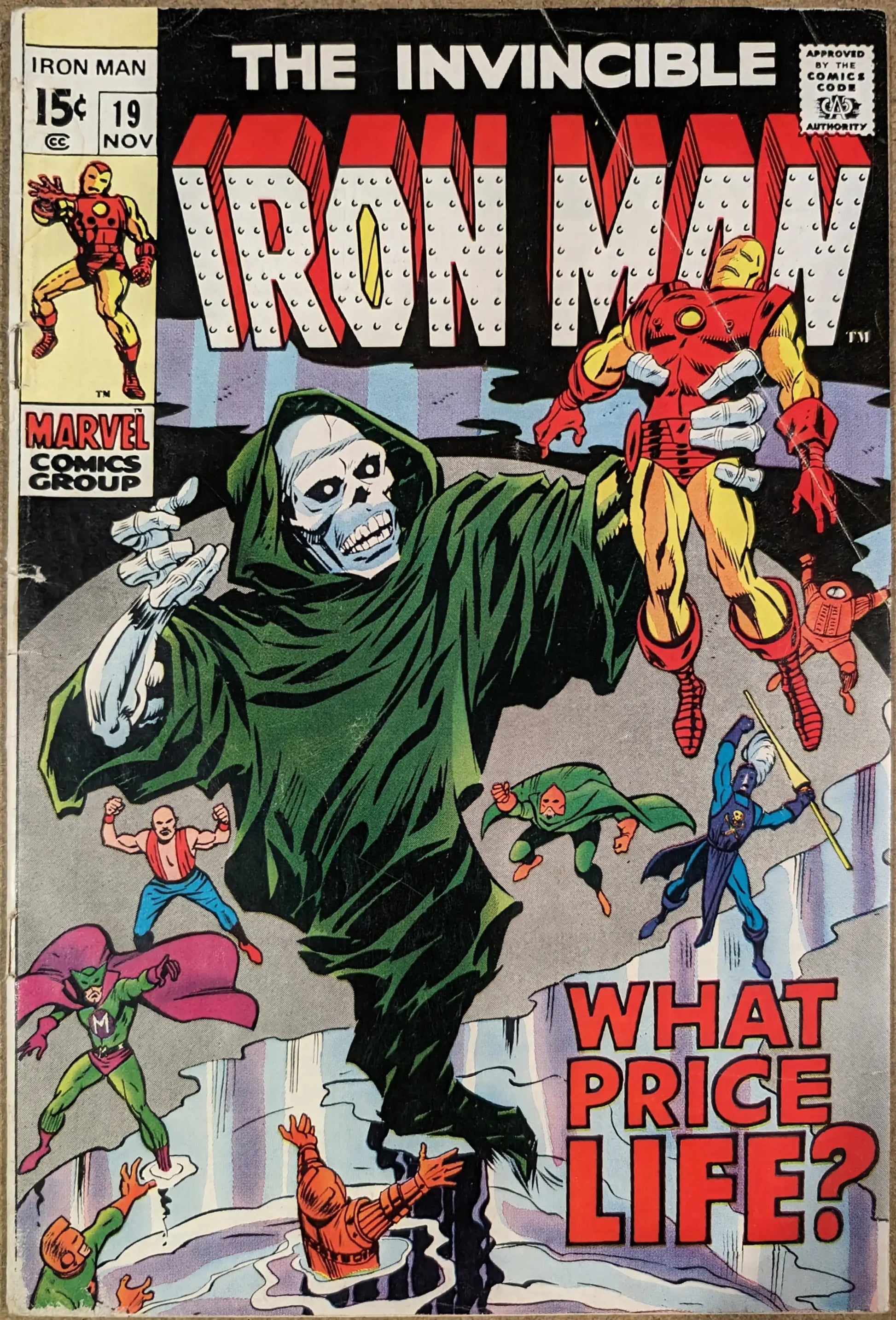 Vintage Invincible Iron Man comic cover with hooded figure confronting Iron Man