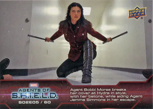 Crouched fighter with two batons featured in Marvel Agents of SHIELD Chase Card