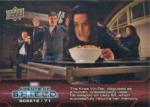 A woman holding a bowl of food in a dramatic scene on Marvel Agents of SHIELD Chase Card