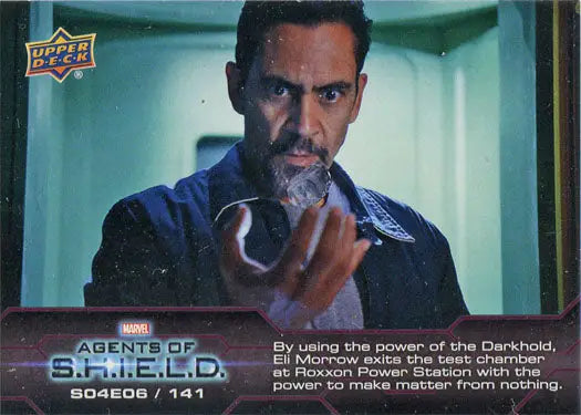 Man with a beard examines glowing object in Marvel Agents of SHIELD Chase Card image