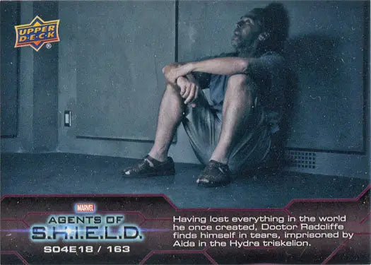 Distressed person on floor highlighted in Marvel Agents of SHIELD Chase Card 163