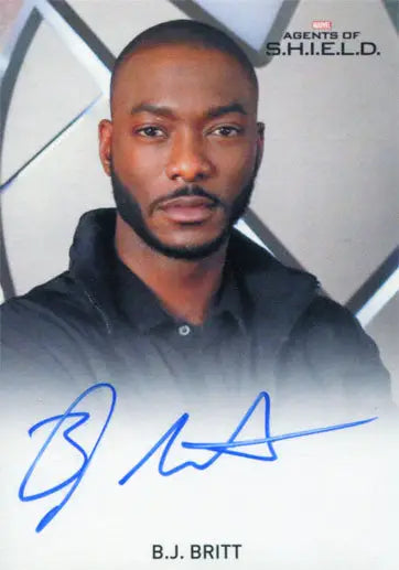 Headshot of B.J. Britt as Agent Triplett on Marvel autograph card with geometric background