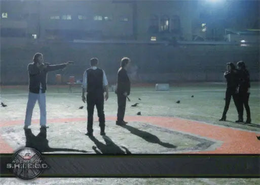 Group of people at night on sports field for Marvel Agents of SHIELD Gold Parallel trading card