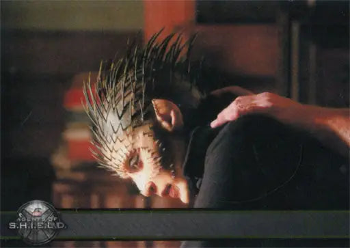 Person with spiky hair flipping head dramatically on Marvel Gold Parallel trading card