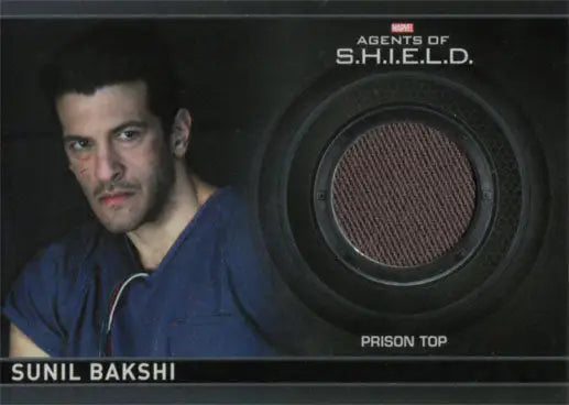 Trading card CC16 featuring man’s portrait and ’Prison Top’ fabric swatch from Marvel Agents of SHIELD