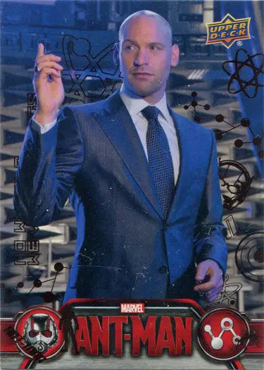 Bald man in blue suit raises hand beside Marvel Ant-Man Bronze Base Parallel Chase Card