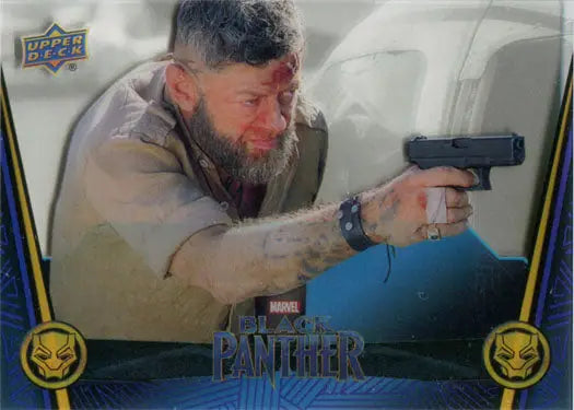 Bearded man in a coat aiming handgun on Marvel Black Panther trading card