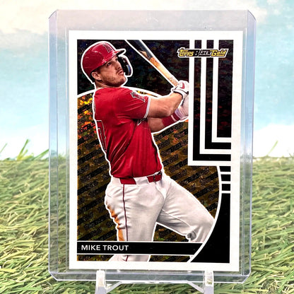 Baseball card of Mike Trout mid-swing in red Angels uniform from Update Series Black