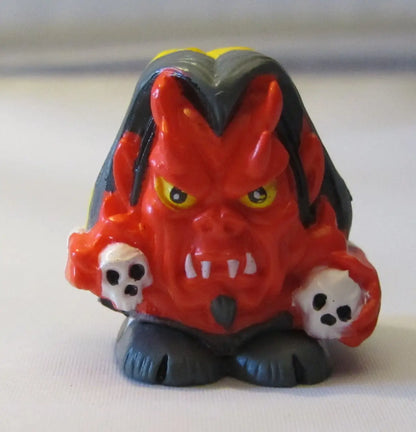 Red demonic figurine with yellow horns from NEW NFL TeenyFreaks trading cards collection