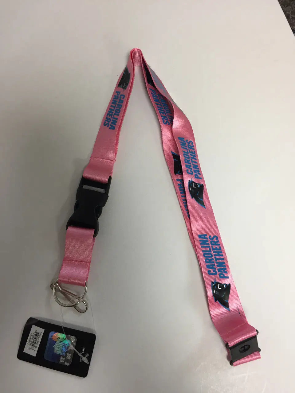 Pink lanyard featuring blue text and heart designs for NFL team logo and trading cards