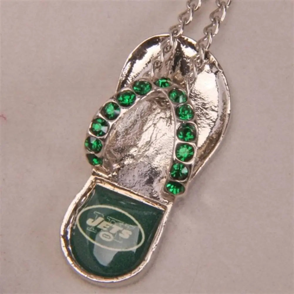 Silver flip flop necklace with green gemstones and New York Jets logo, crystal flip flop design