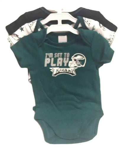 Green infant onesie with I’m set to play and Philadelphia Eagles helmet graphic design