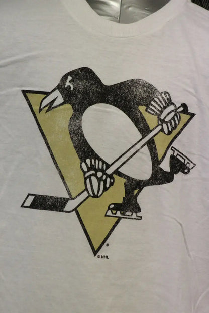 Penguin-shaped logo with hockey stick on official licensed NHL Pittsburgh Penguins tee shirt