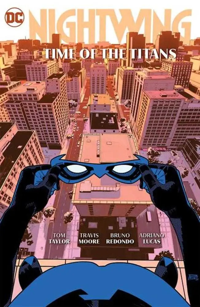 Nightwing adjusting his mask above the cityscape in Time Of The Titans hardcover