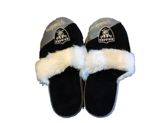 Black and white fuzzy slippers with team logo patch in cursive colorblock design