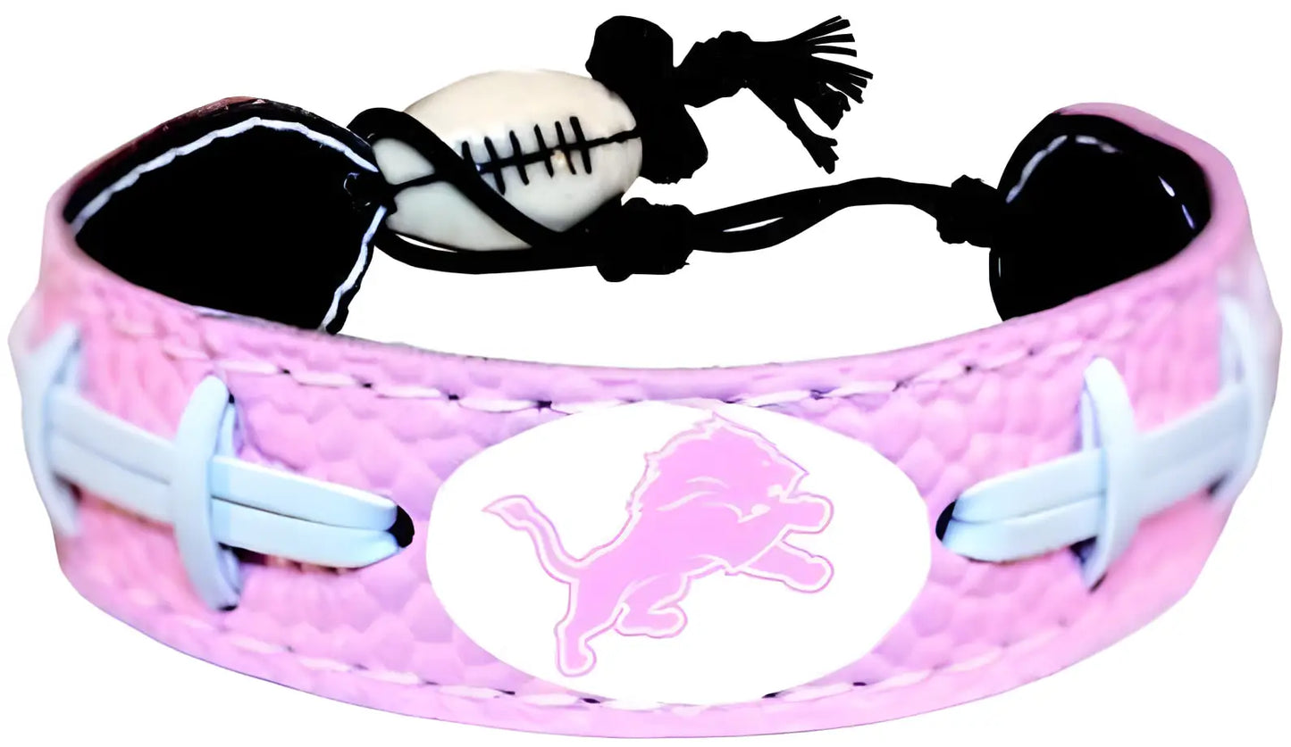 Pink sports bracelet with white oval logo and pink lion for NFL football cards