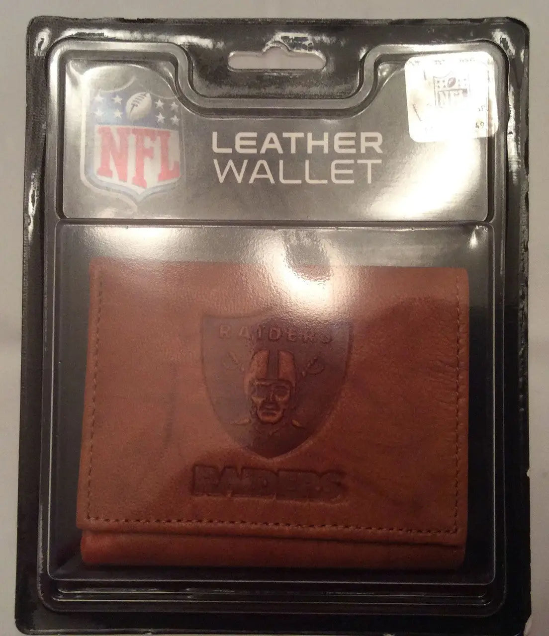 NFL Embossed Leather Wallet featuring Raiders logo in retail packaging