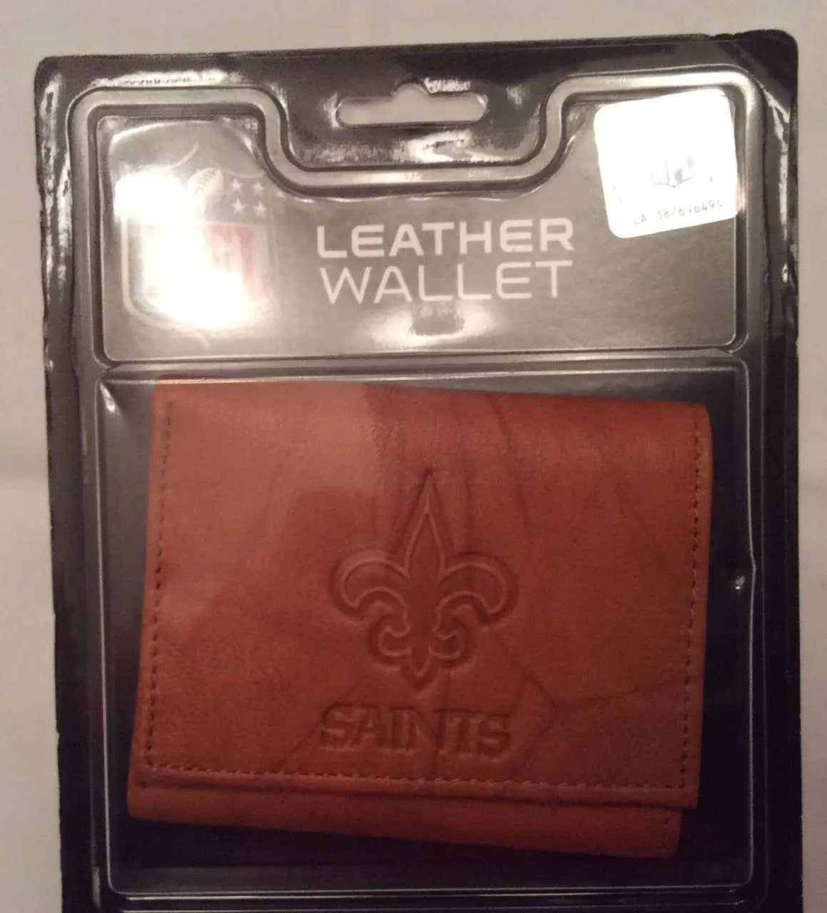 Brown NFL embossed leather wallet featuring New Orleans Saints logo and text