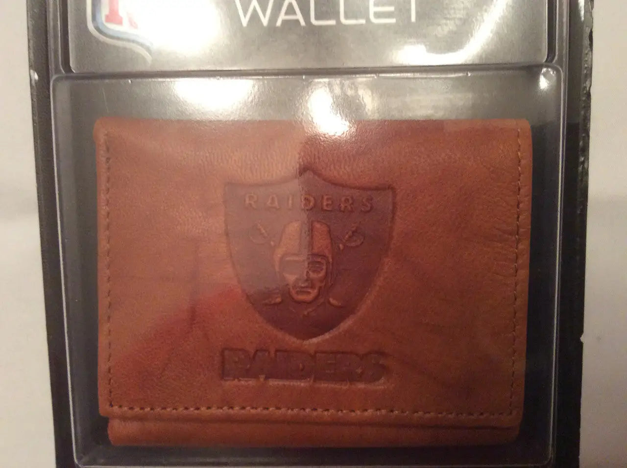 Brown NFL embossed leather wallet with Raiders logo for fans and collectors