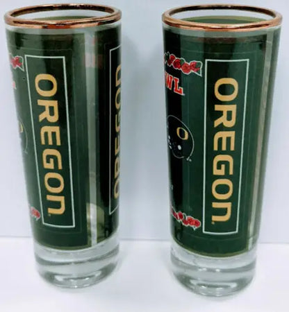 Two original gloss Oregon Ducks shot glasses from the 2010 Rose Bowl lot