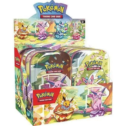 Display box of Pokémon TCG tins with Eeveelution artwork from Scarlet & Violet—Prismatic