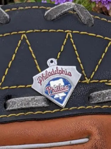 Philadelphia Phillies baseball logo charm on a black leather glove with pewter pendant