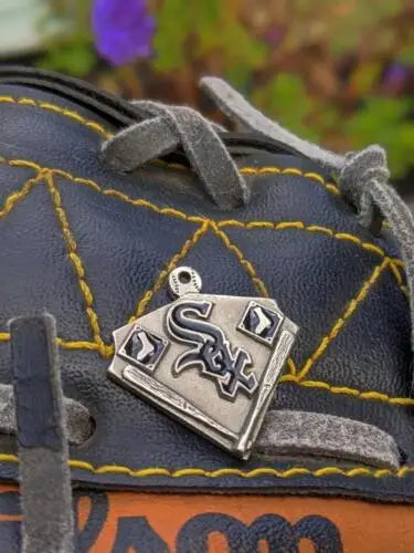 Chicago White Sox pewter pendant on leather glove with yellow stitching for fans