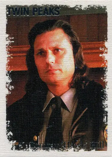 Portrait of Tommy Hawk Hill in a brown suit, featured in Twin Peaks original stars trading cards